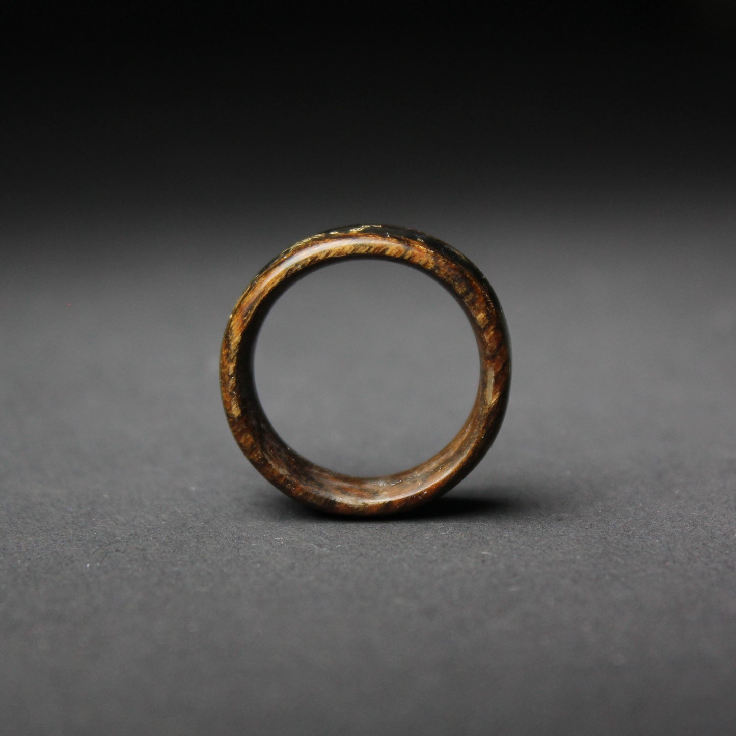 Bocote Wood Ring Inlaid with Crushed Black Stone and Brass Shavings